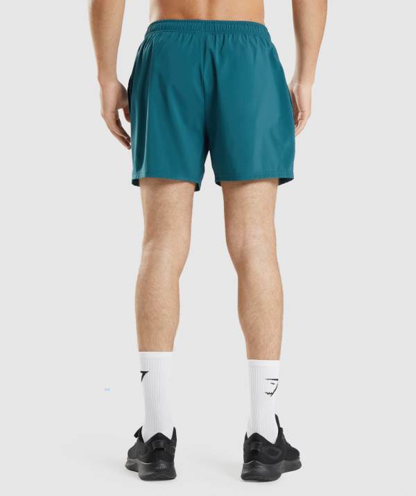 Panske Šortky Gymshark Arrival 5" Tyrkysové | OI2648705